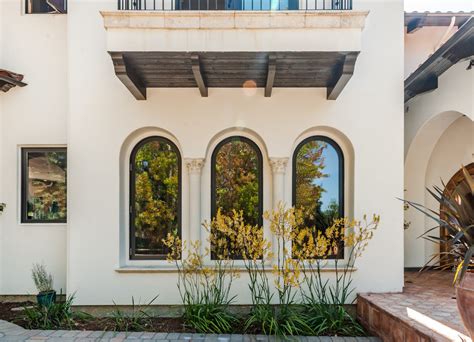 Mediterranean Windows With Corbeled Arches Mediterranean Exterior