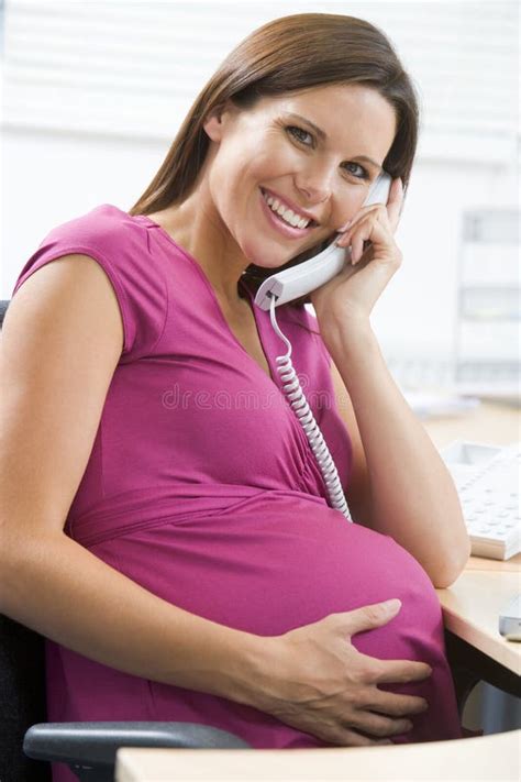 Pregnant Woman At Work Using Telephone Smiling Stock Image Image Of