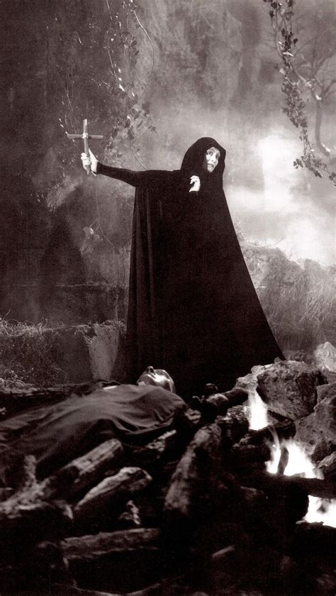 An Old Black And White Photo Of A Woman In A Nun Costume With Her Arms