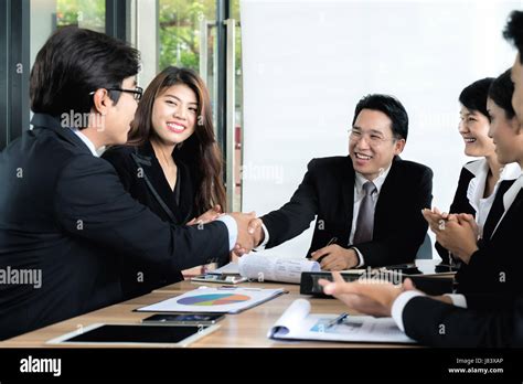 Group Of Asian Business People Meeting At Outdoor Cafe Businessmen