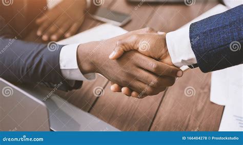 Handshake Of Two African American Businessmen At Meeting Stock Photo