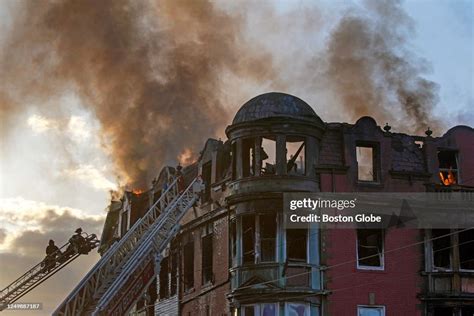 Firefighters Use Ladders To Battle A 5 Alarm Fire At A Rooming House News Photo Getty Images