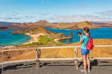 Galapagos Islands Tourist Hiking Taking Photo On Bartolome Island Hike