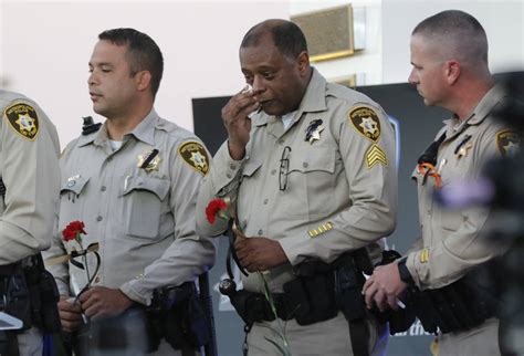 Las Vegas Police Officers React During A Candlelight Vigil For Las Vegas Police Officer