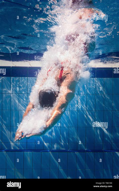 Swimmer Diving Into Pool Stock Photo Alamy