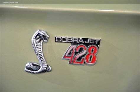 An Emblem On The Side Of A Car That Says Cobrajet 428 With A Snake