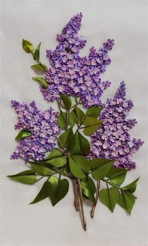 A Bunch Of Purple Flowers With Green Leaves