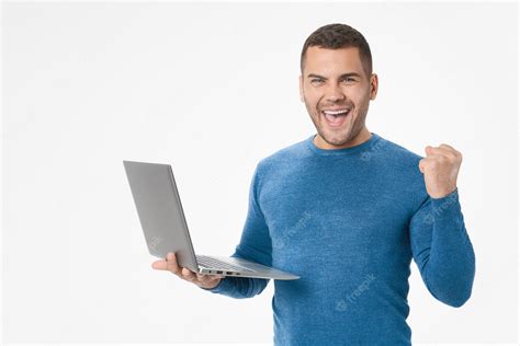 Premium Photo Portrait Of Joyful Young Man With Laptop Computer