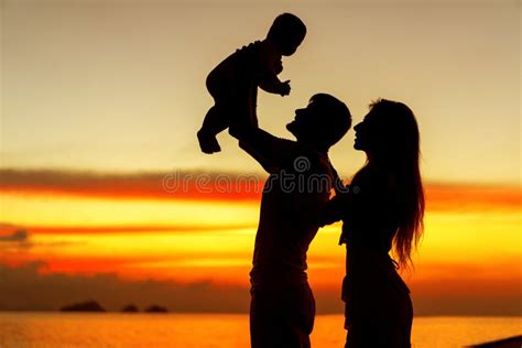 .Family in Love with Son Hugging at Sunset, Silhouette Stock Image - Image of evening, summer ...