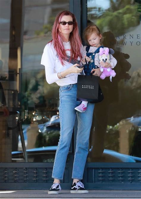 Behati Prinsloo Goes Shopping Out With Her Daughter At Barneys New York