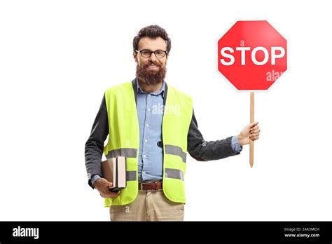 Full Length Portrait Of A Man Holding Books Wearing Safety Vest And