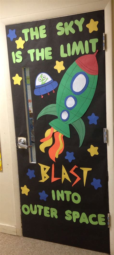 A Door Decorated With An Image Of A Rocket Ship And The Words The Sky