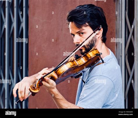 Street musician violin player busker hi-res stock photography and ...