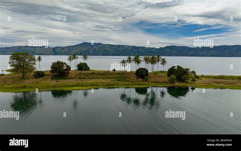 Aerial View Of Beautiful Lake Toba And An Island With Palm Trees