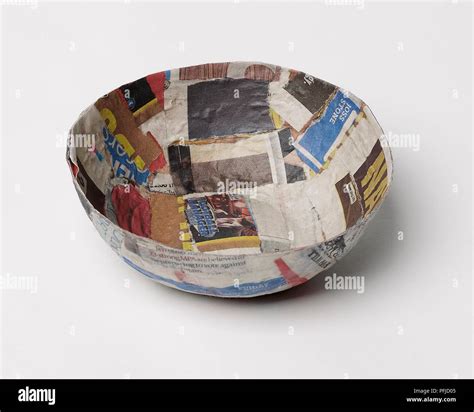 Papier Mache Bowl Made From Torn Newspaper And Magazine Pages Stock