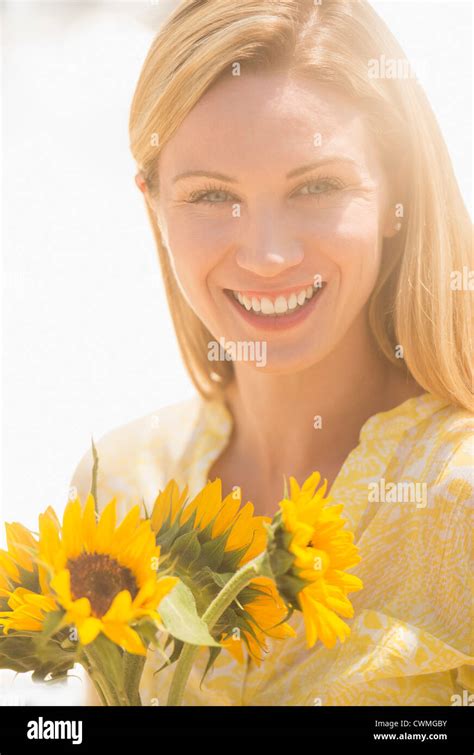 Woman Carrying Sunflowers Hi Res Stock Photography And Images Alamy