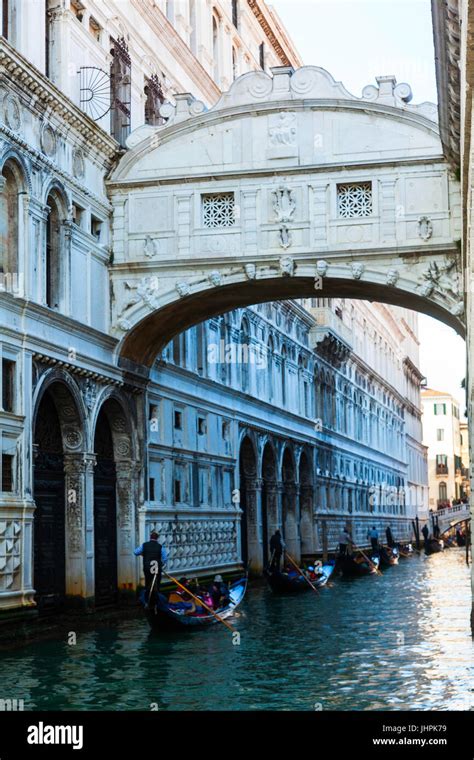 Venice Italy The Bridge Of Sighs Gondola Floats On A Canal Among Old