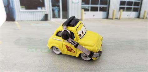 Disneys Pixar Cars Luigi 1959 Fiat 500 With Headset Yellow J7556