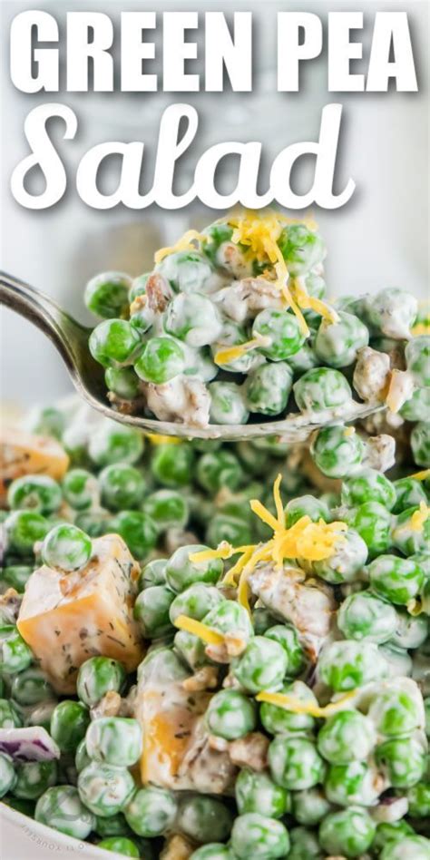 Green Pea Salad In A White Bowl With A Ladle Full Of Peas And Cheese