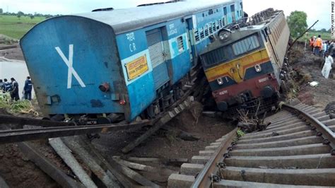 Twin trains veer off bridge in India killing dozens - CNN