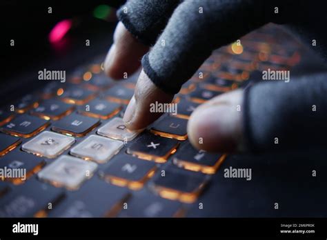 Hacker Hand Stealing Data From Laptop Top Down Stock Photo Alamy