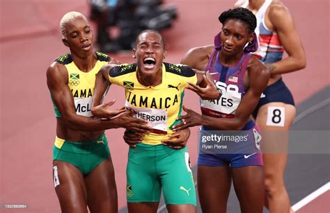 Candice Mcleod Of Team Jamaica And Quanera Hayes Of Team Usa Assist