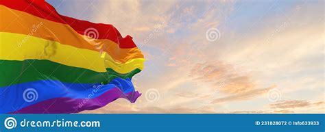 Gay Pride Flag Waving In The Wind At Cloudy Sky Freedom And Love