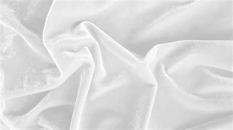 White velvet fabric texture used as background. Empty white fabric ...