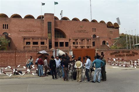 Media personnel wait outside the Gaddafi Stadium | ESPNcricinfo.com