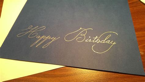 Writing a birthday card. I think the handwriting looked nice. What do ...