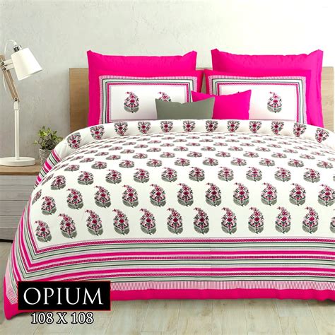 Shades of magenta on white double bedsheet in cotton and two pillow ...