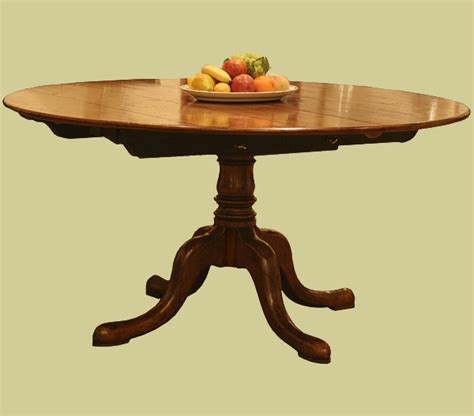 circular extending dining table english oak  pedestal base
