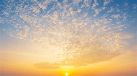 Premium Photo | Bright sunrise and golden clouds on blue sky nature ...