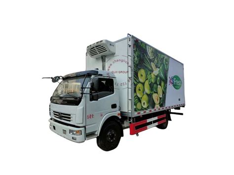 The Truck Is White And Has Green Apples On It