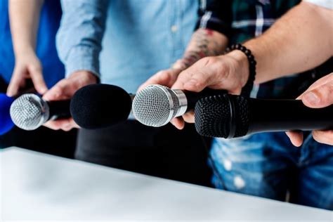 Premium Photo | Hands holding microphone for an interview