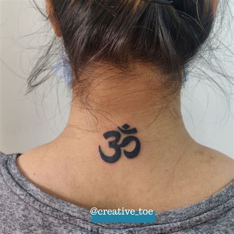 An Om Tattoo Is A Popular Symbol Related To Enlightenment And Is Often