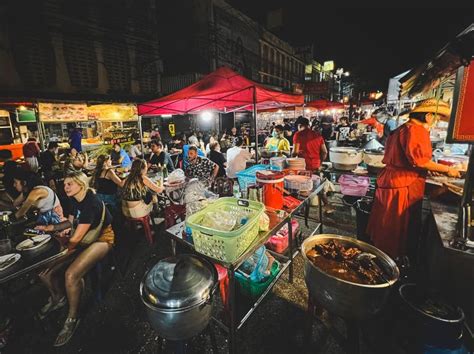 Night Street Food Market in Bangkok, Thailand Bustling with Shoppers ...