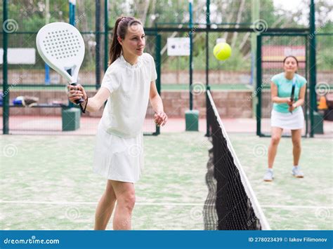 Active Womans With Enthusiasm Playing Padel On Tennis Court Stock Image