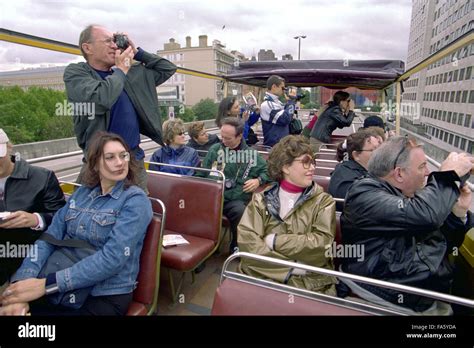 PICTURE SHOWS TOURISTS ABOARD 'THE RED TOUR' , RUN BY 'THE BIG BUS ...