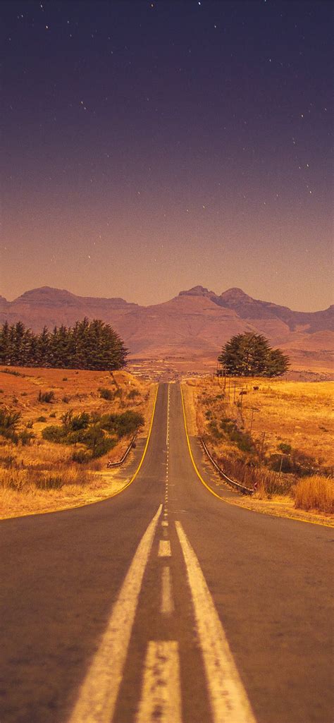 view of a long empty road iPhone Wallpapers Free Download