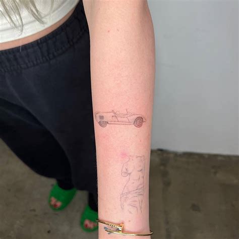 Fresh Racing Car And Healed Venus De Milo Tattoos