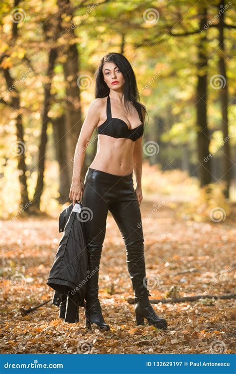 Beautiful Dark Haired Young Woman Wearing A Black Bra Leather Jacket