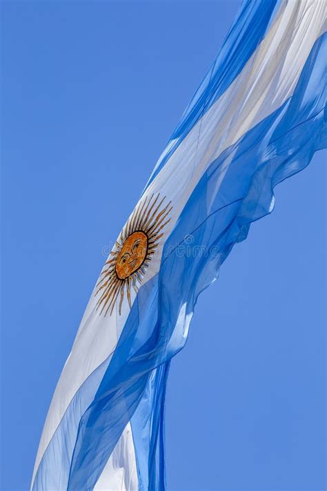 Argentine Flag Flying On A Flagpole Against A Blue Sky On A Sunny Day Patriotic Symbol Of