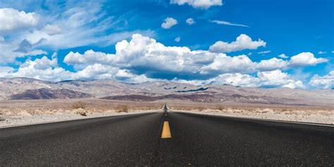 Premium Photo | Empty road with mountain in background