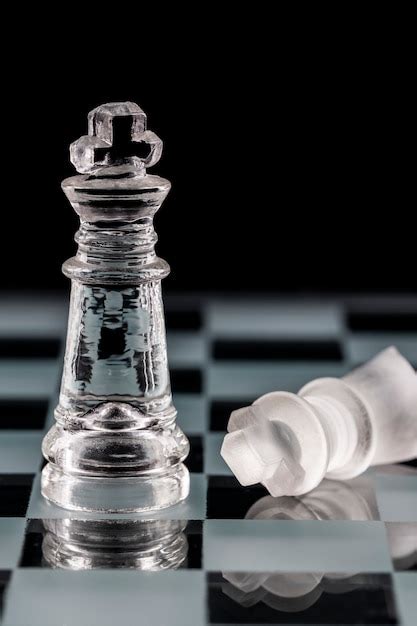 Premium Photo | Glass chess pieces on a glass chessboard with ...