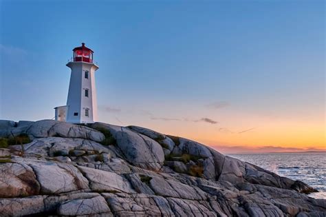 Premium Photo | Peggy's cove lighthouse at sunset