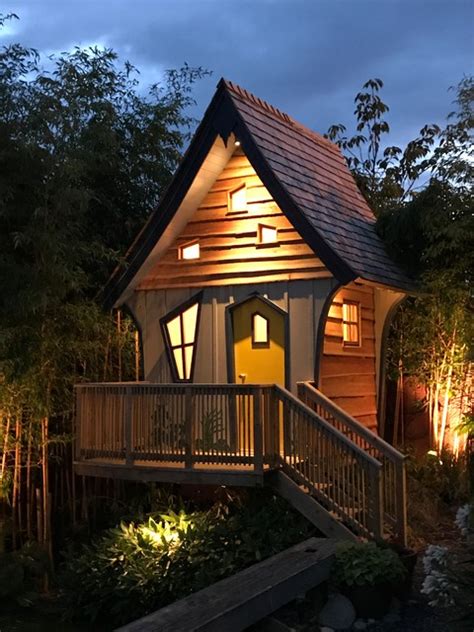 The Crooked House Treehouse At Night Arts And Crafts Garden Shed And