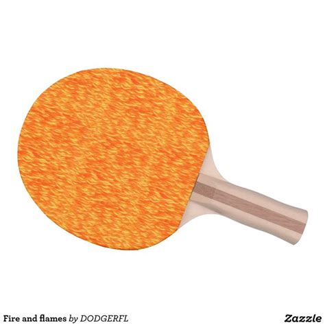 An Orange Ping Pong Paddle On A White Background With The Words Fire