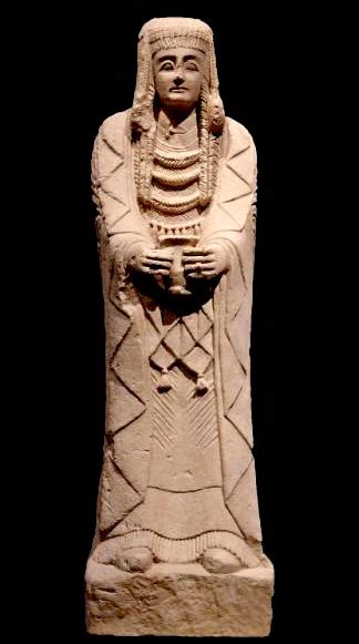 An Ancient Statue Is Shown Against A Black Background