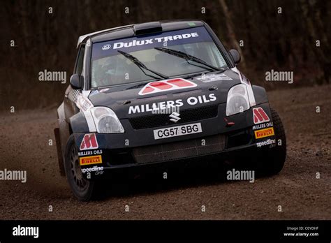 Callum Black black Suzuki Swift Rally Car running through Wareham Forest at the Bournemouth ...